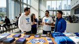 Attendees and staff wearing custom branded apparel at event
