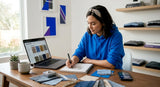 Clothing brand owner sketching designs at kitchen table