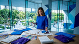 Woman comparing apparel samples in design workspace