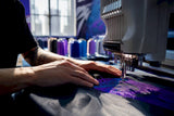 Hands stitching embroidery on fabric
