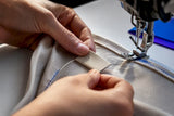 Center-fold woven label sewn into neckline