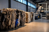 Textile waste bales inside recovery facility