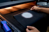 Printer inspecting dye migration on polyester swatches
