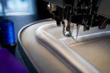 Raised satin embroidery stitching over foam