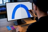 Designer inspecting vector curves and pixel grid
