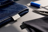 Woven and printed labels on garment edges