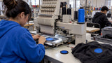 Embroidery machine stitching a dense logo patch