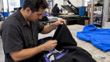 Technician inspecting a printed fleece hoodie