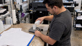 Technician weighs pretreatment for polyester panel