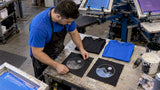 Printer comparing discharge and plastisol test prints