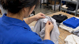 Technician checking a sewn-in apparel care label