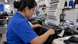 Stabilizer backing supporting fabric in an embroidery hoop